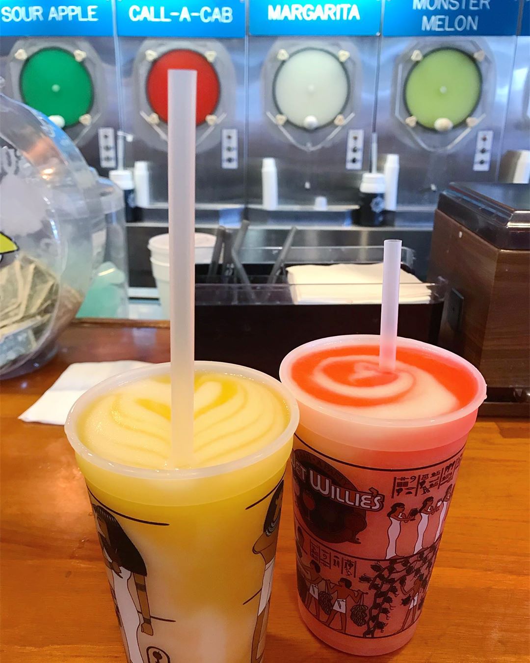 Red and yellow blended cocktails at bar. Photo by Instagram user @new_england_eats