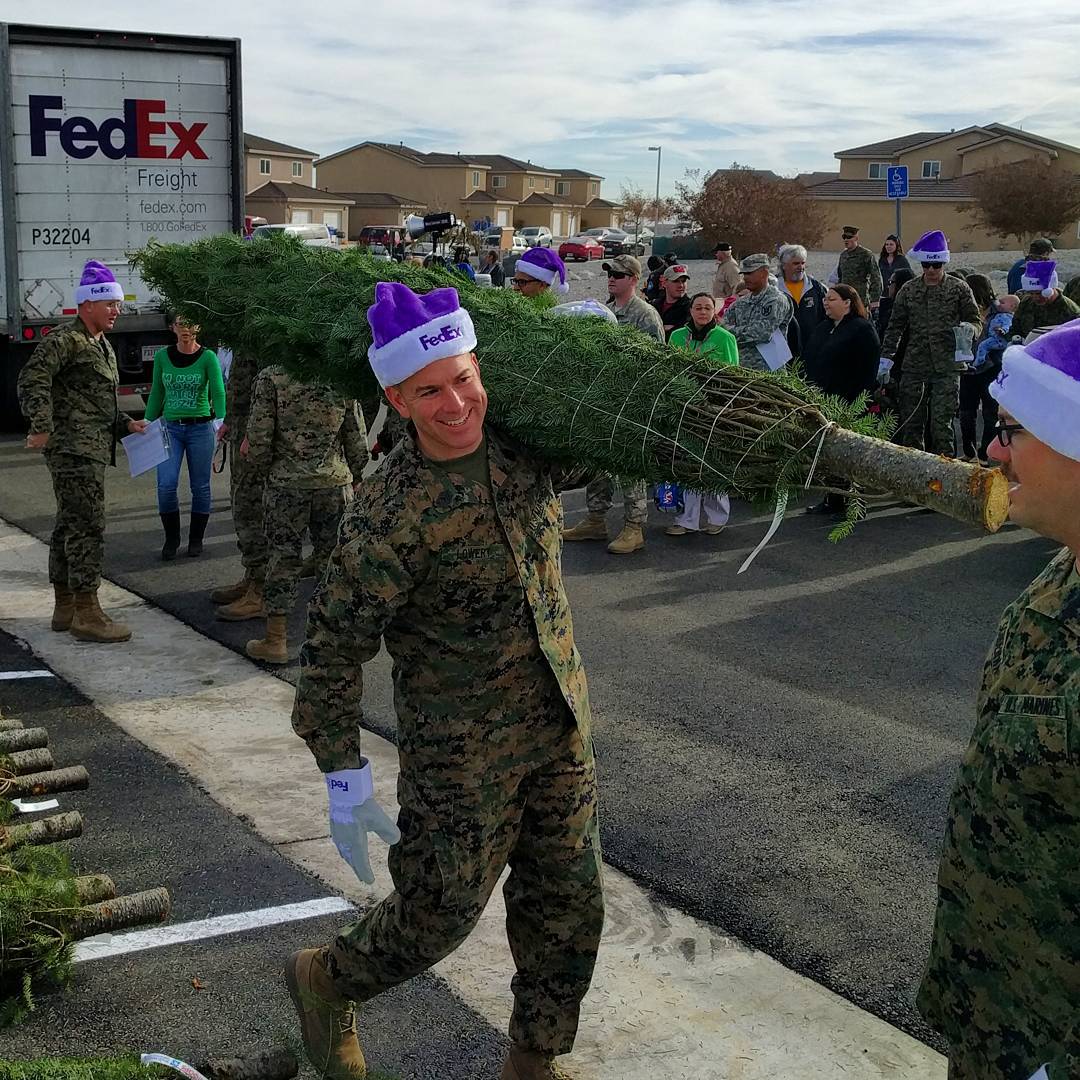 Military service member carrying a tree. Photo by Instagram user @mccscp