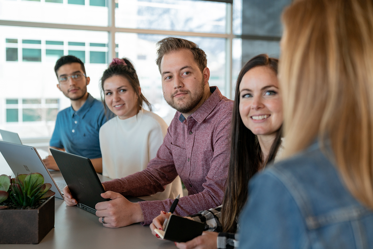 Extra Space Storage team members meeting at corporate office