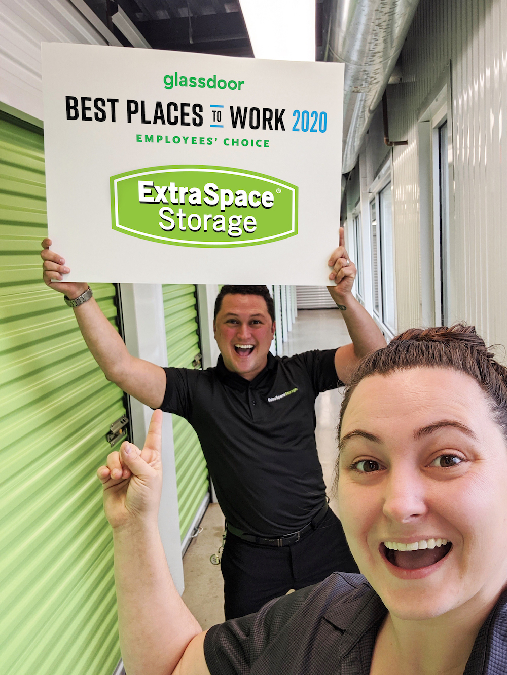 Extra Space Storage team members holding sign that says Glassdoor Best Places to Work 2020