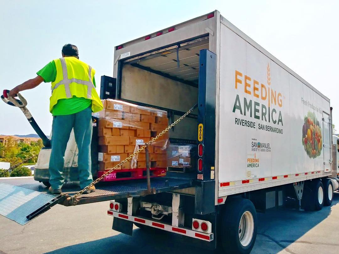 Guy removing items out of food truck. Photo by Instagram user @feedingamericaie