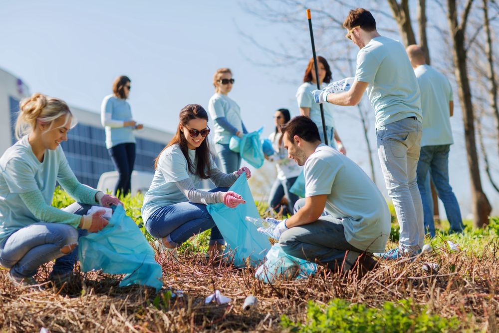 Group of volunteers cleaning up neighborhood