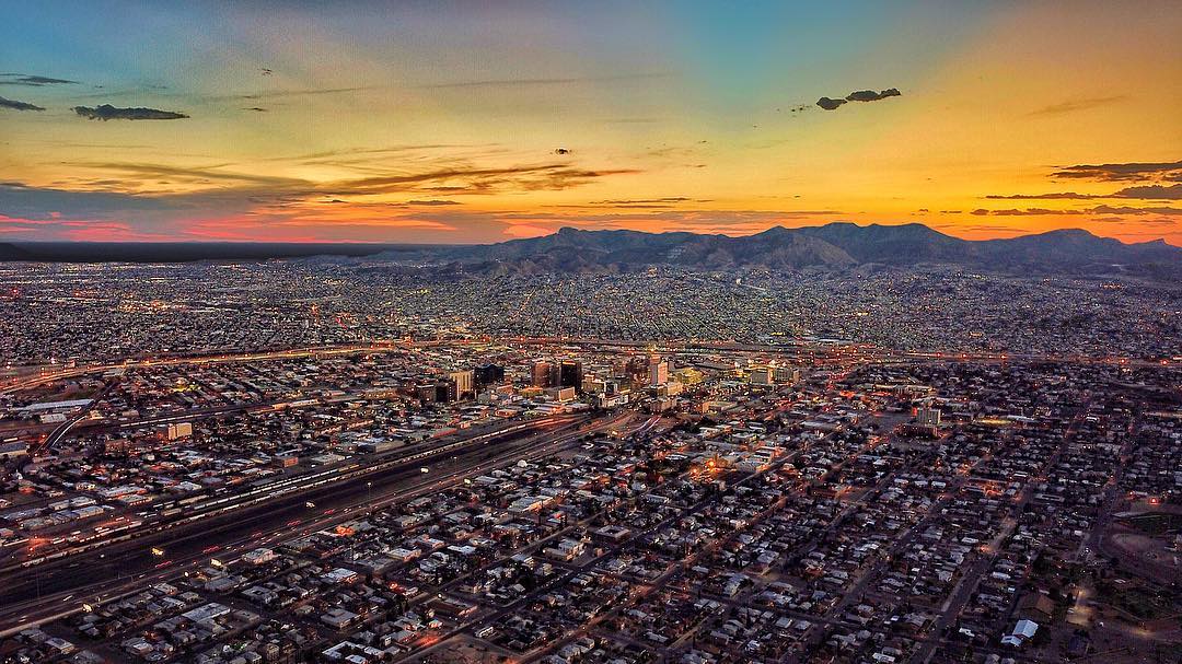 Skyline of buildings and houses in El Paso at sunset. Photo by Instagram user @seanseansean