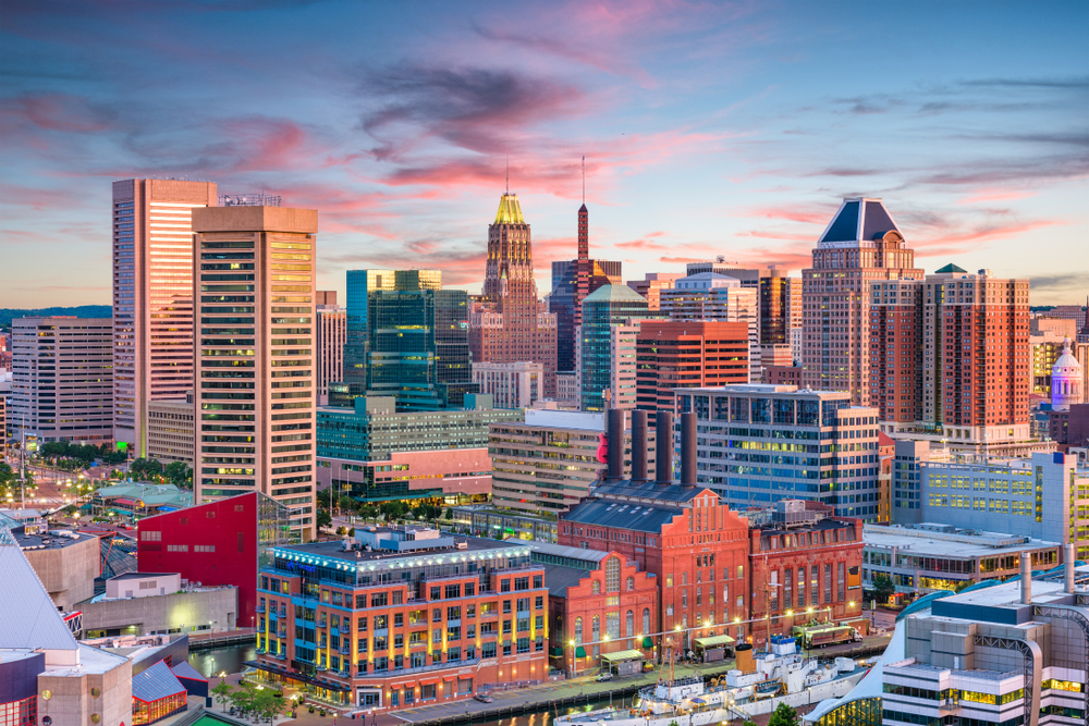 Skyline of tall buildings in Baltimore during sunset