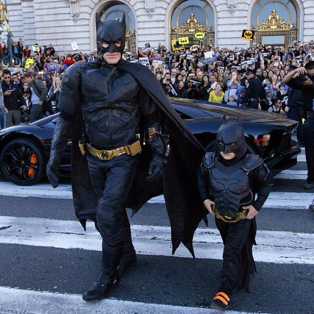 Man and little boy dressed as batman. Photo by Instagram user @batkidbegins