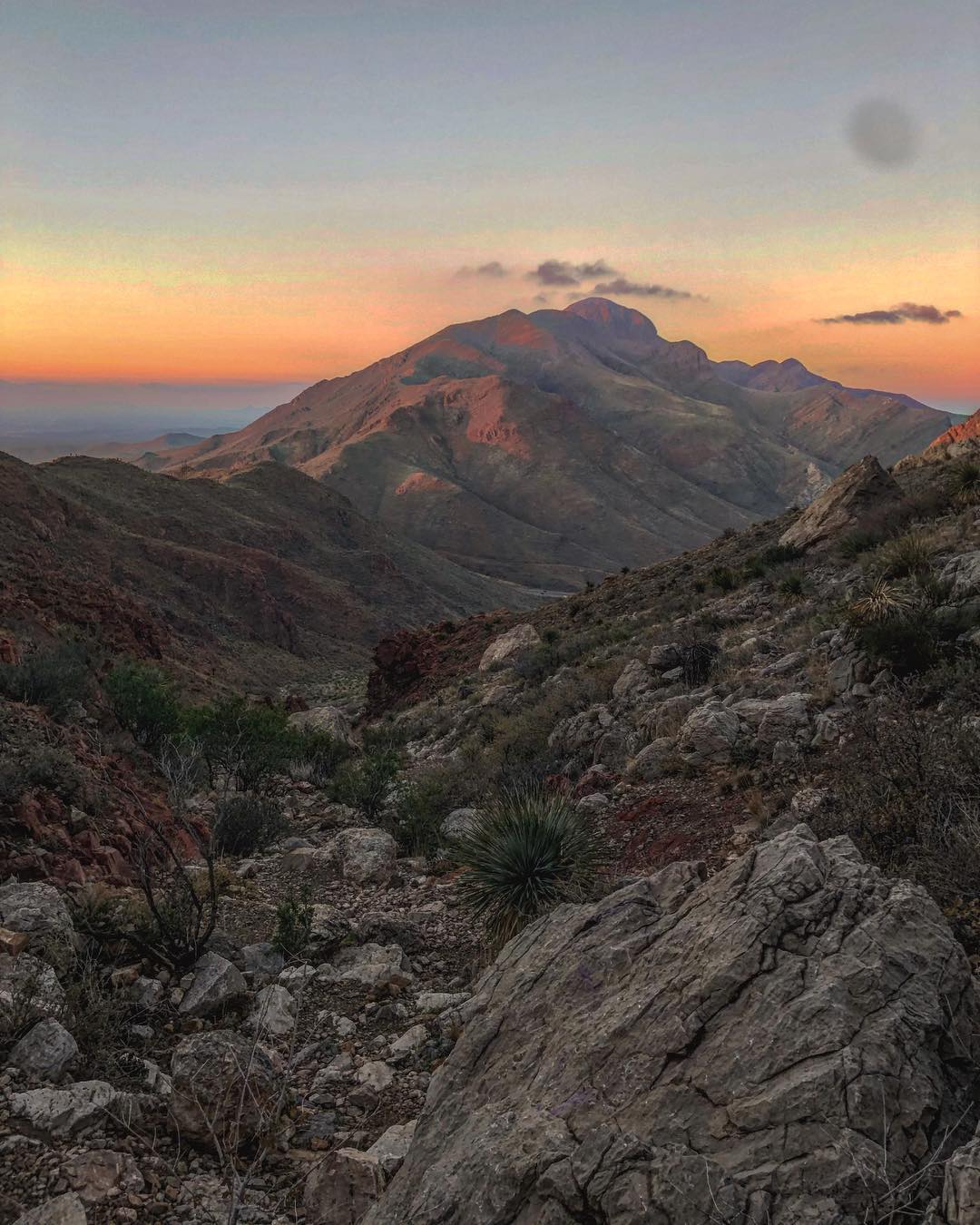 Aerial view of mountains at sunset. Photo by Instagram user @onthe1edge