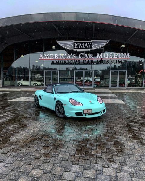 Light blue Porsche in front of LeMay: America's Car Museum. Photo by Instagram user @bellevue_boxster.