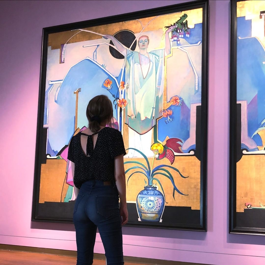 Girl admiring painting at museum. Photo by Instagram user @orlandomuseumofart