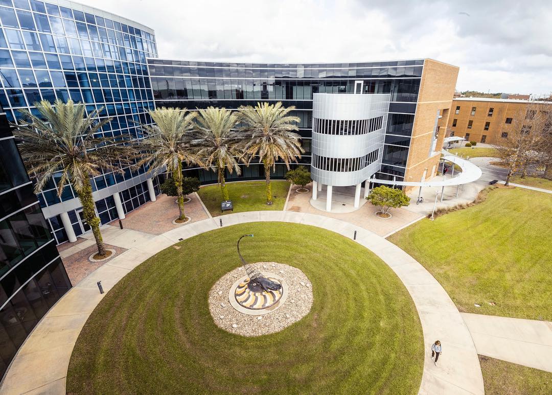 Aerial view of glass building and campus at University of Central Florida. Photo by Instagram user @ucf.edu