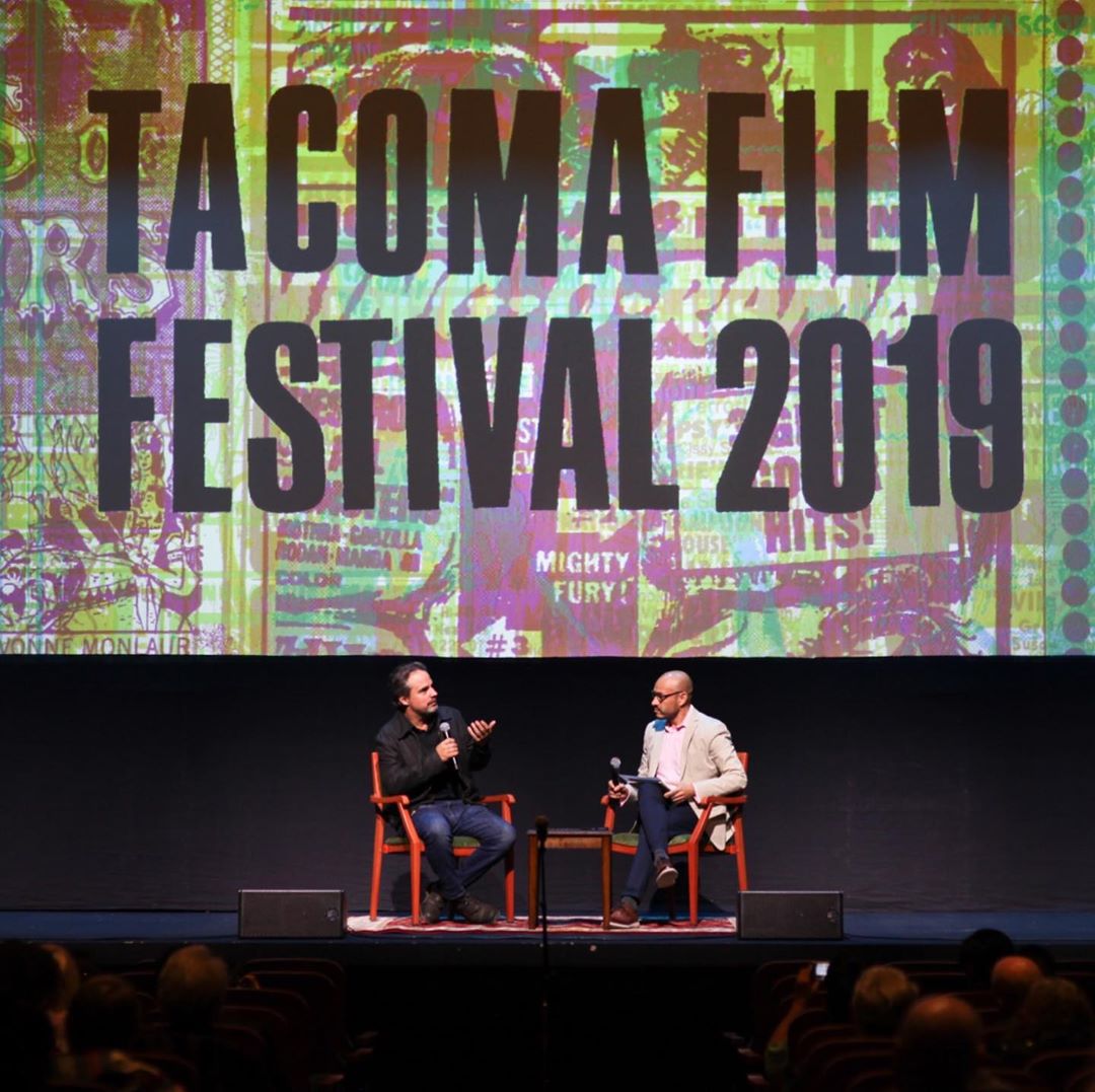 Two guys sitting on stage at Tacoma Film Festival. Photo by Instagram user @tacomafilmfest