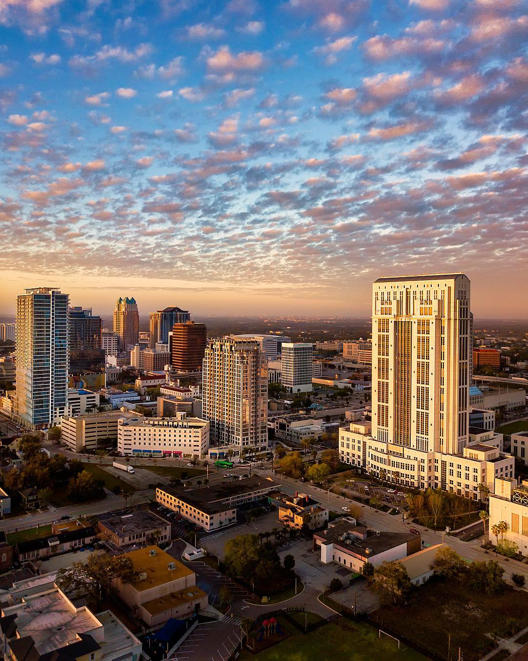 Tall buildings in Downtown Orlando at sunset. Photo by Instagram user @stevenmadow