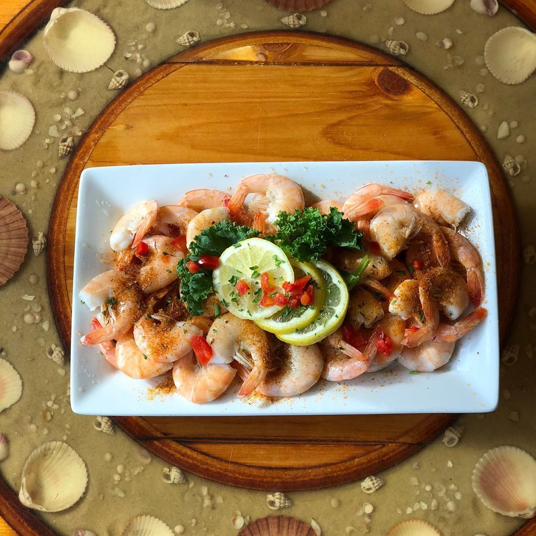 Plate of shrimp on a table. Photo by Instagram user @captaingeorges