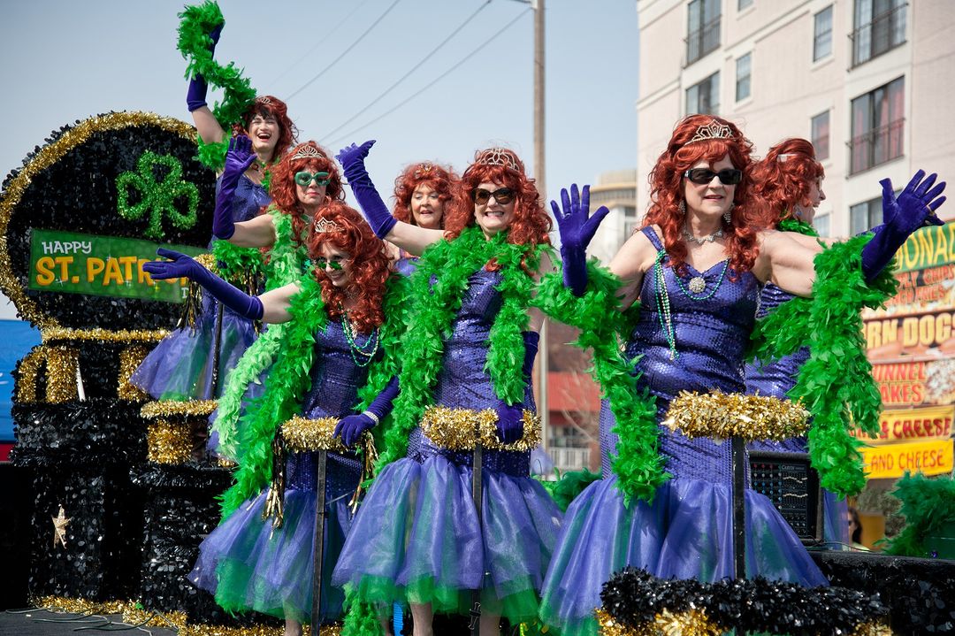 Costumed people wave at the crowd on a St. Patrick's Day float during Columbia's St. Pat's in Five Points celebration. Image by Instagram user @stpatsinfivepoints.