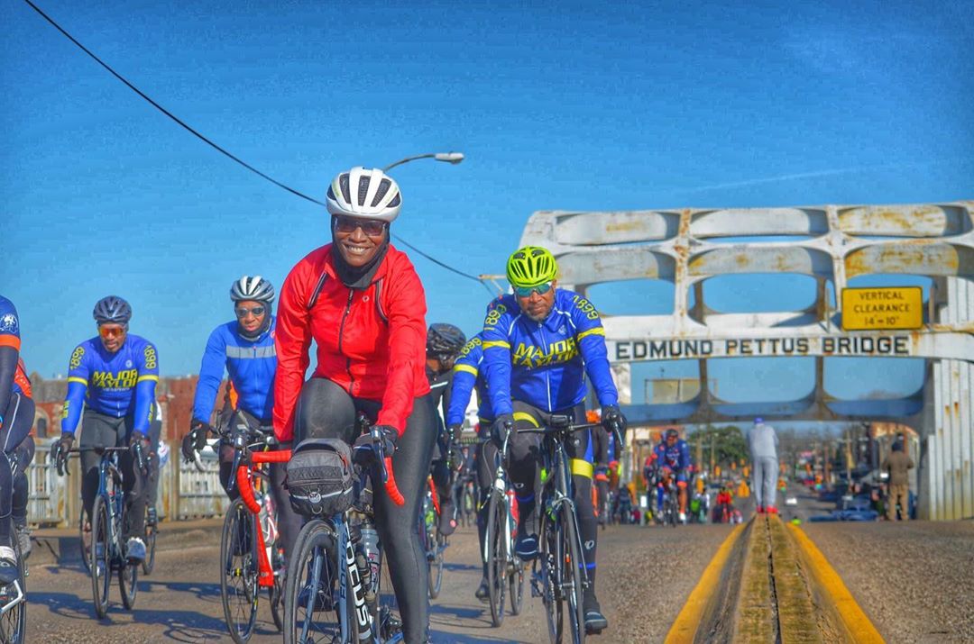 Group of people riding bikes on Selma bridge. Photo by Instagram user @blackgirlsdobikesd