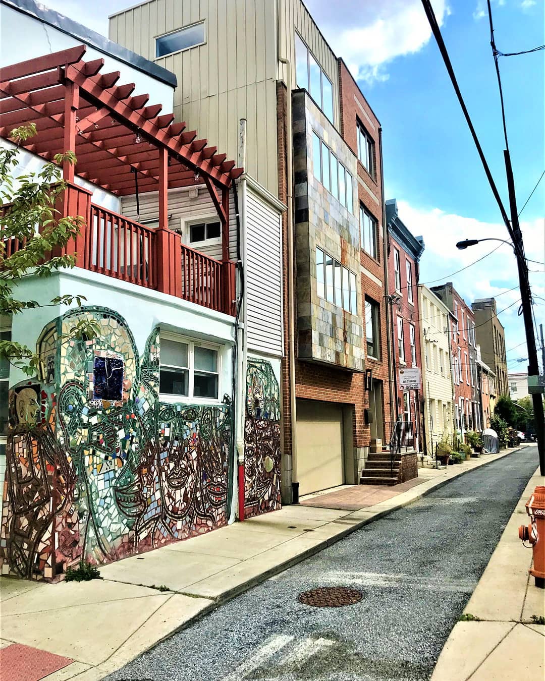 Buildings with mural painted on it in Bella Vista, Philadelphia. Photo by Instagram user @localphillyliving