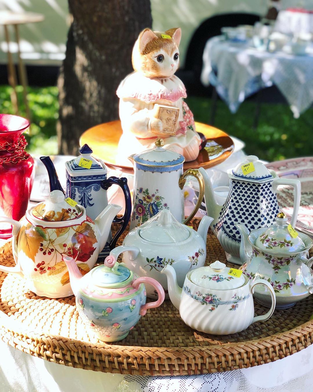 Porcelain floral tea pots at garage sale. Photo by Instagram user @losdog 
