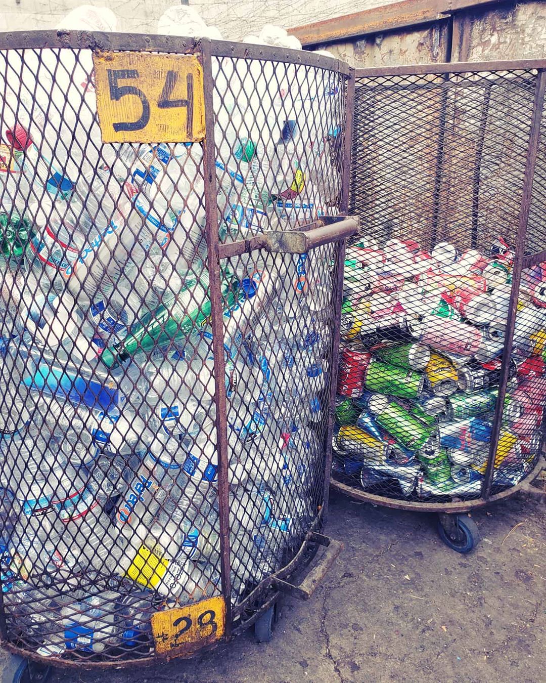Recycle bins filled with cans and bottles. Photo by Instagram user @globalmetalrecyclinginc