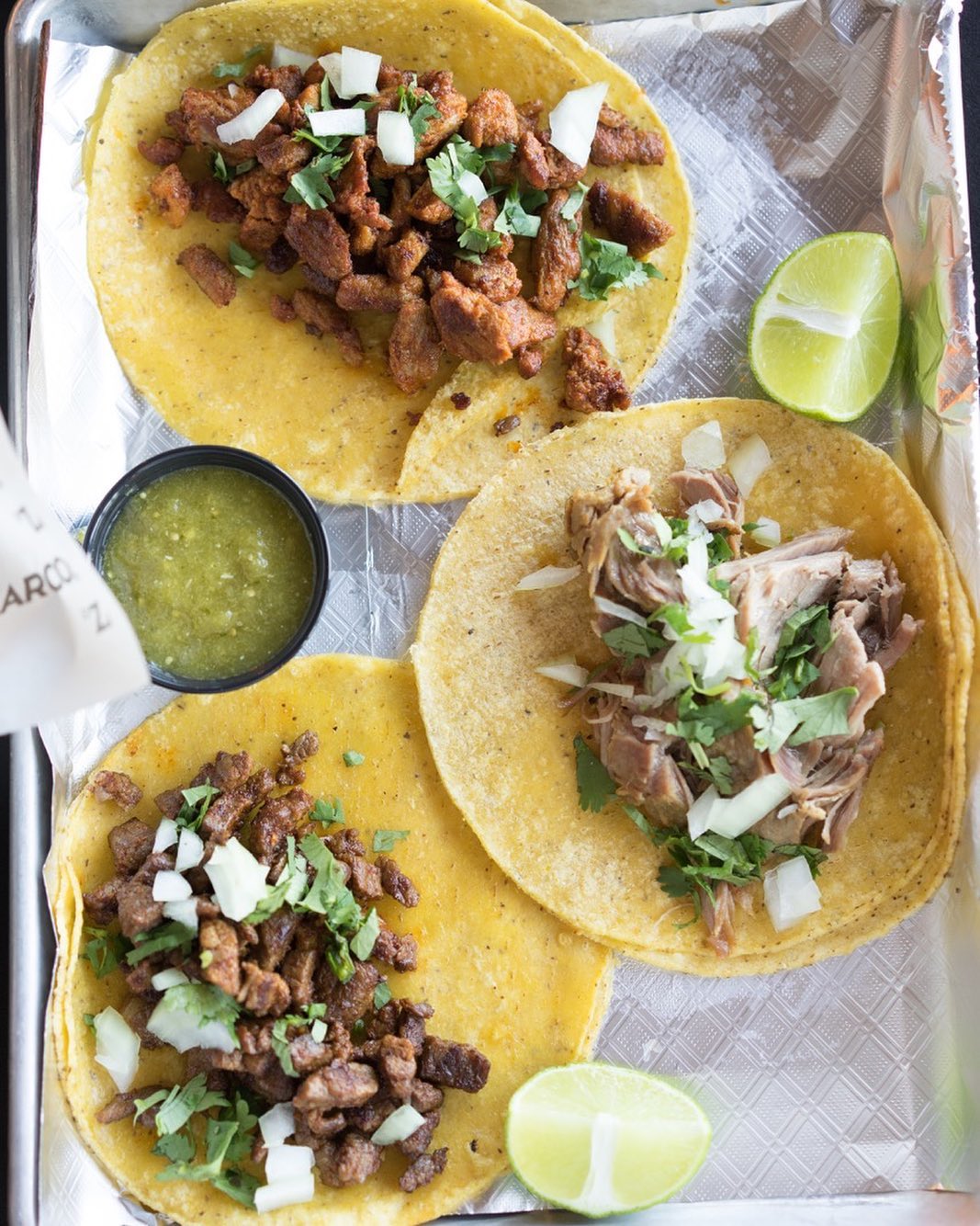 Tray of three tacos. Photo by Instagram user @solrestaurante
