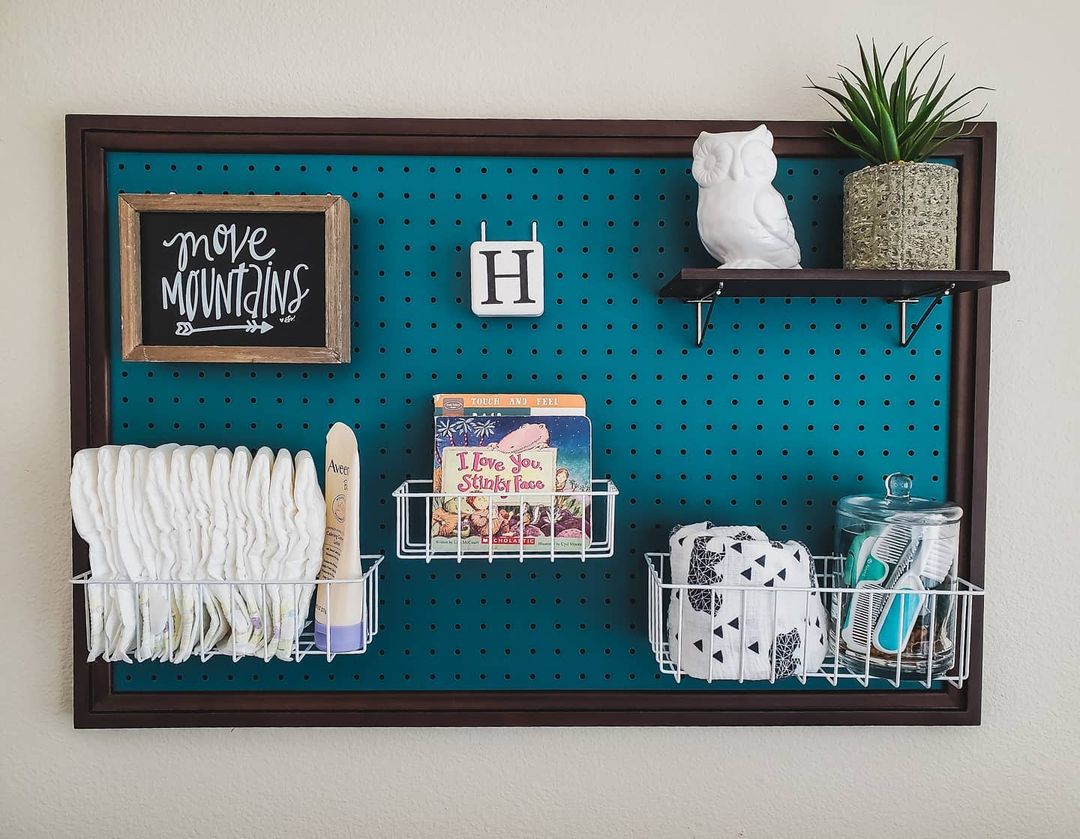 DIY pegboard for a baby room. Photo by @mommaandsprouts.