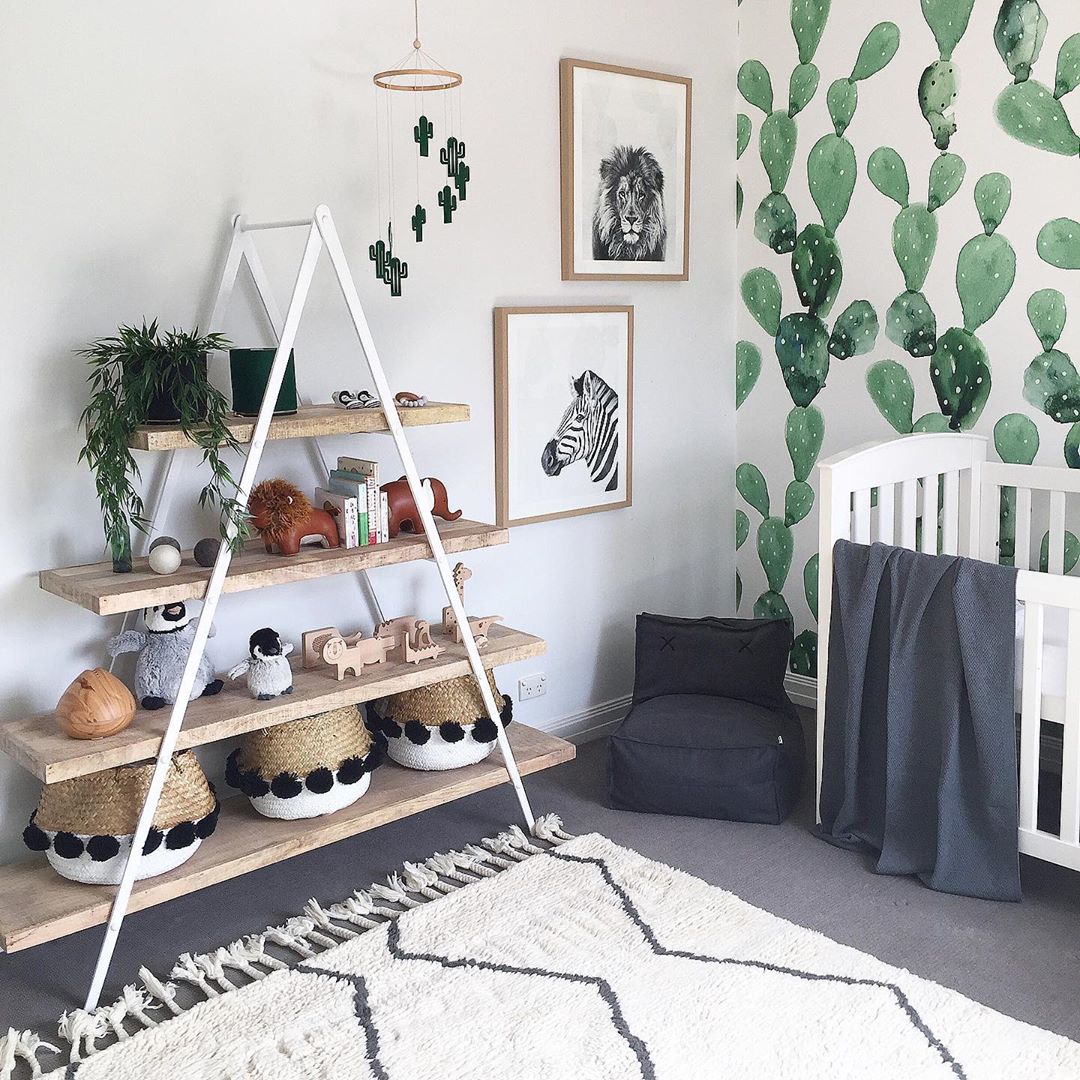 a fram shelf with baskets and trinkets on it with rug on floor photo by Instagram user @liberty.interiors