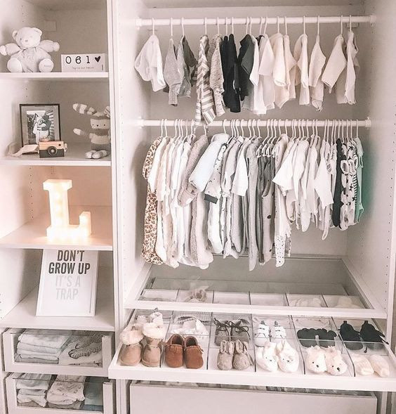 baby closet with extra items installed with clothes hanging photo by Instagram user @jessandjonesnursery