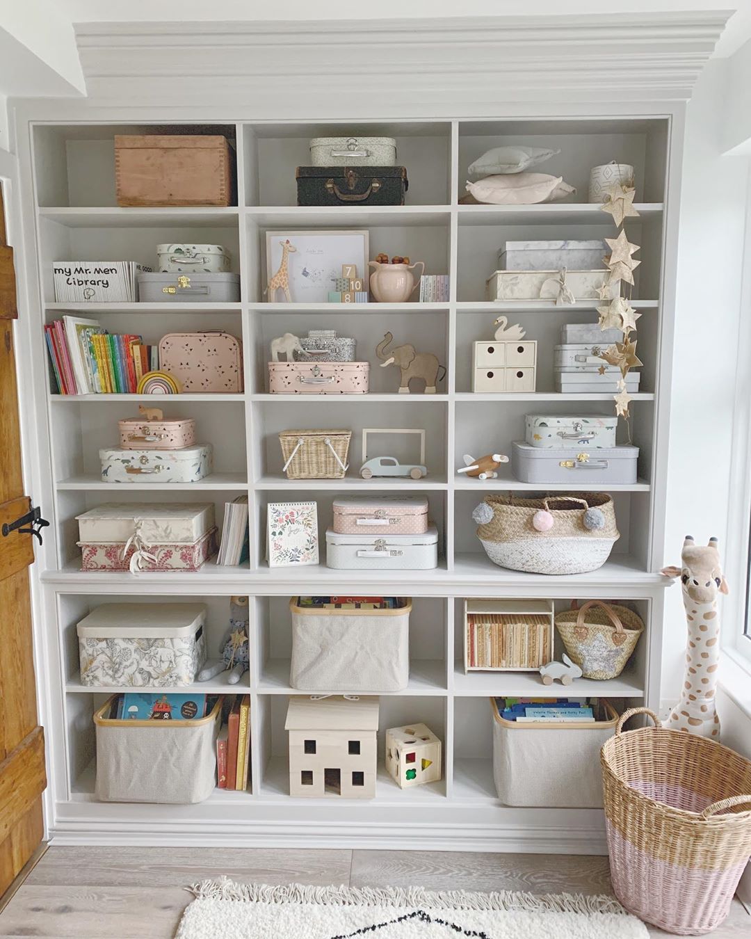 storage wall with individual cubby holes photo by Instagram user @wallflower_cottage