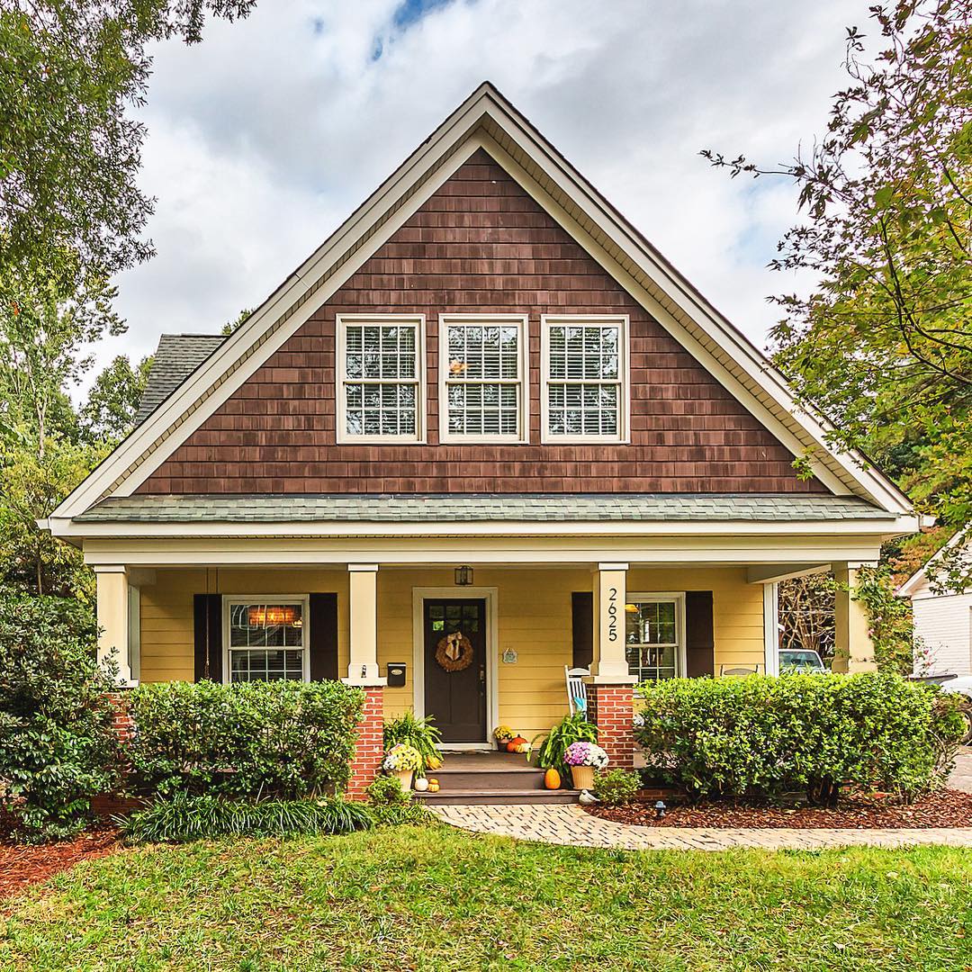 home in chantilly charlotte with yellow siding and green grass photo by Instagram user @gwrealestate