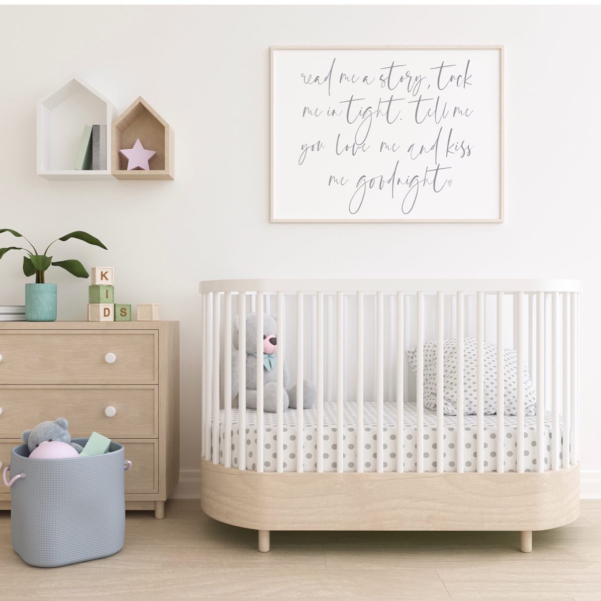 A white nursery with a painting and crib. Photo by Instagram user @_awdesigns_