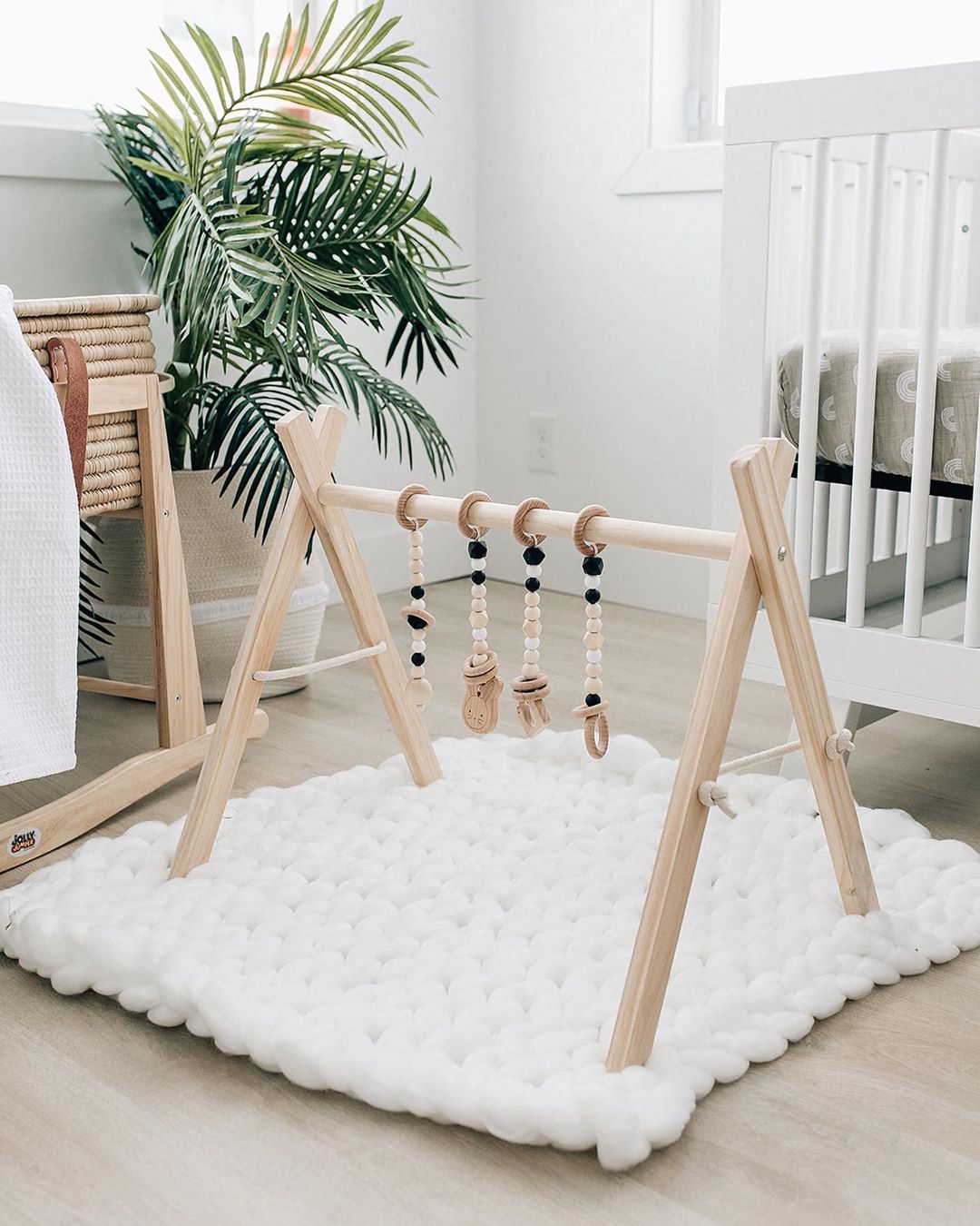 Plush baby mat under toy. Photo by Instagram user @poppyseed.play