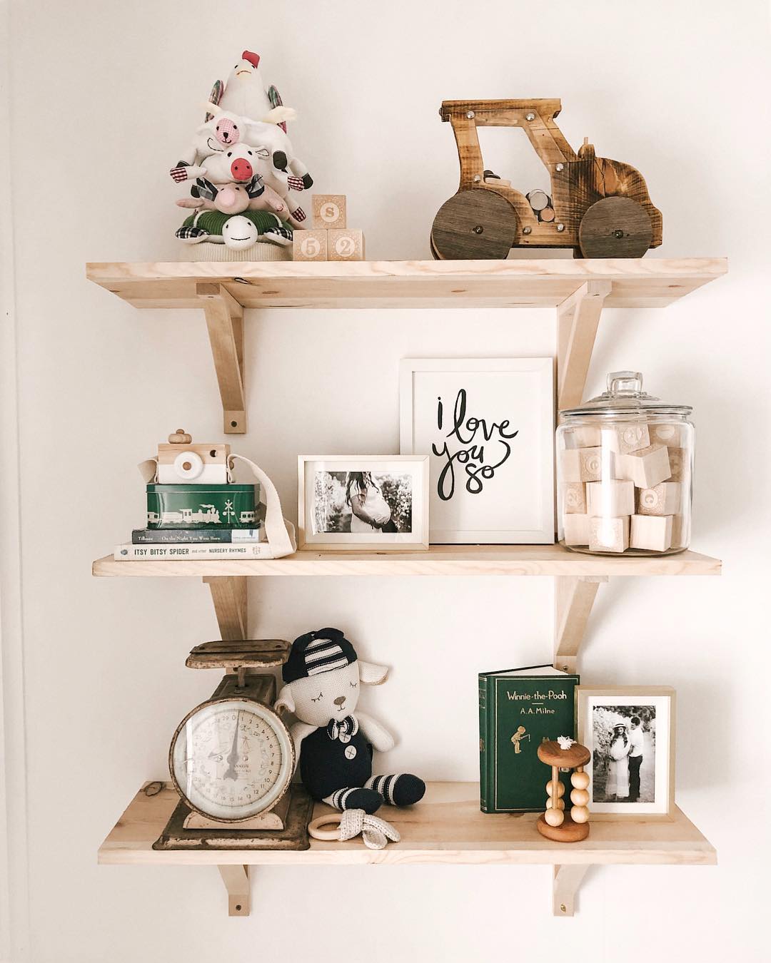 Floating shelves with baby decor. Photo by Instagram user @creativityinthecornbelt
