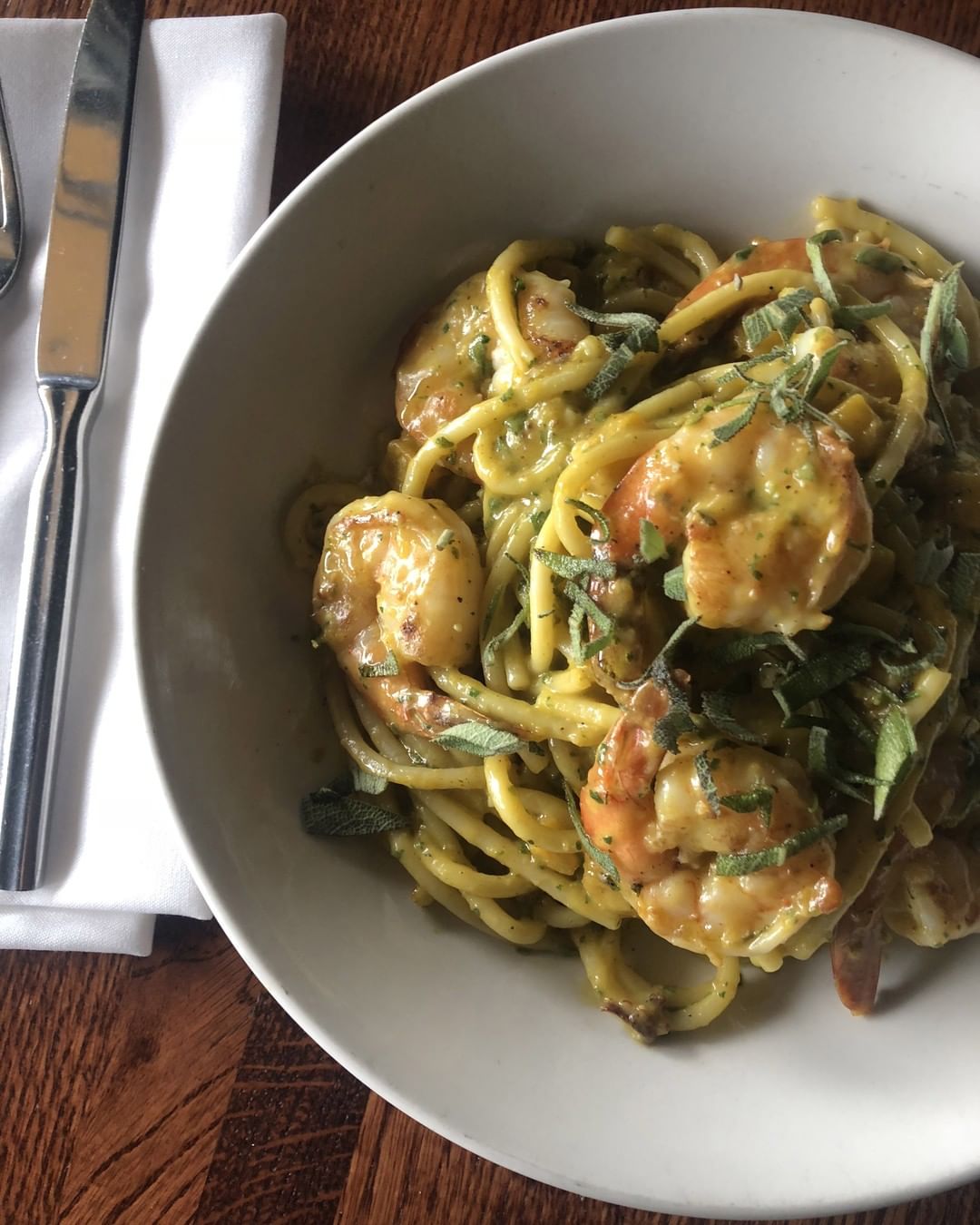 Shrimp bucatini in a white bowl from Waterman Grille in Providence RI photo by Instagram user @watermangrille