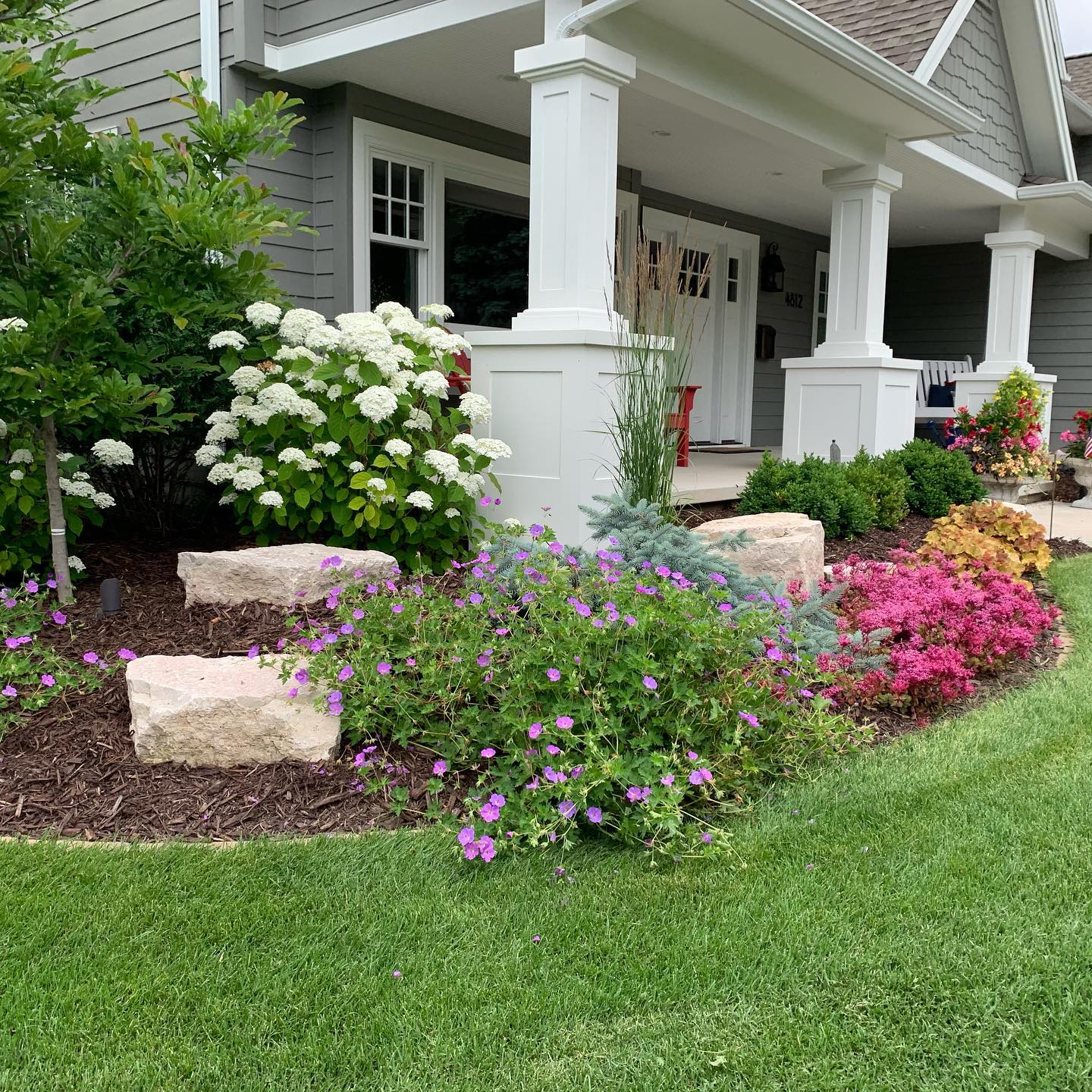 A house with front yard garden. Photo by @sarah.lloyd.landscape.design