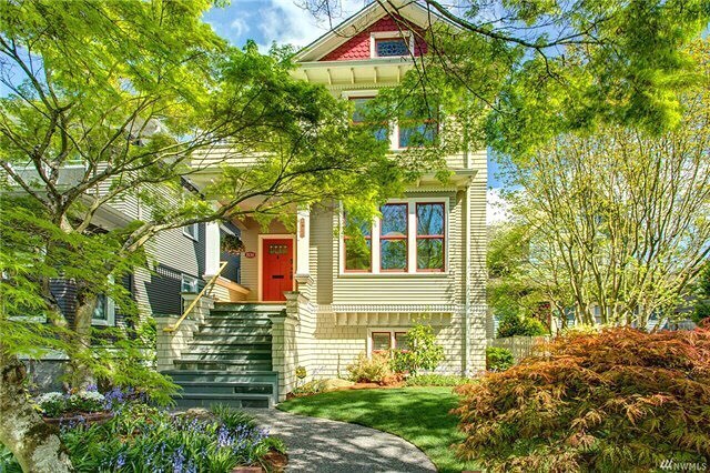 Victorian Style home with a garden walkway and green staircase in Queen Anne, Seattle, WA. Photo by Instagram user @queenannerealestate.
