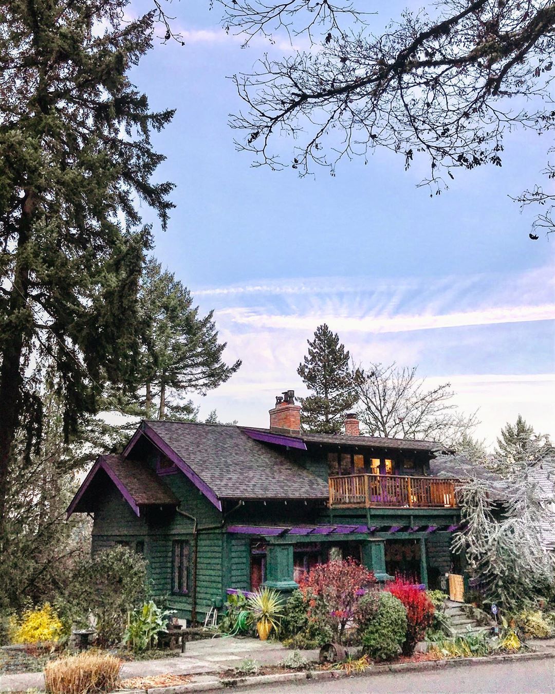 home in forest park, portland, OR with green and purple paint with nice landscaping photo by Instagram user @elvinem11
