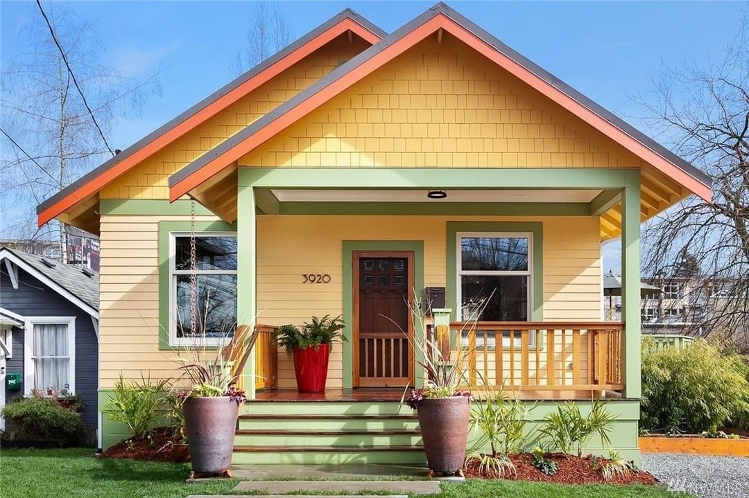 craftsman style home with yellow and green paint in Fremont, Seattle, WA photo by Instagram user @heidiwardrealestatebroker