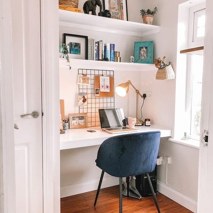 small home office space with small desk lamp and blue chair photo by Instagram user @prem_777