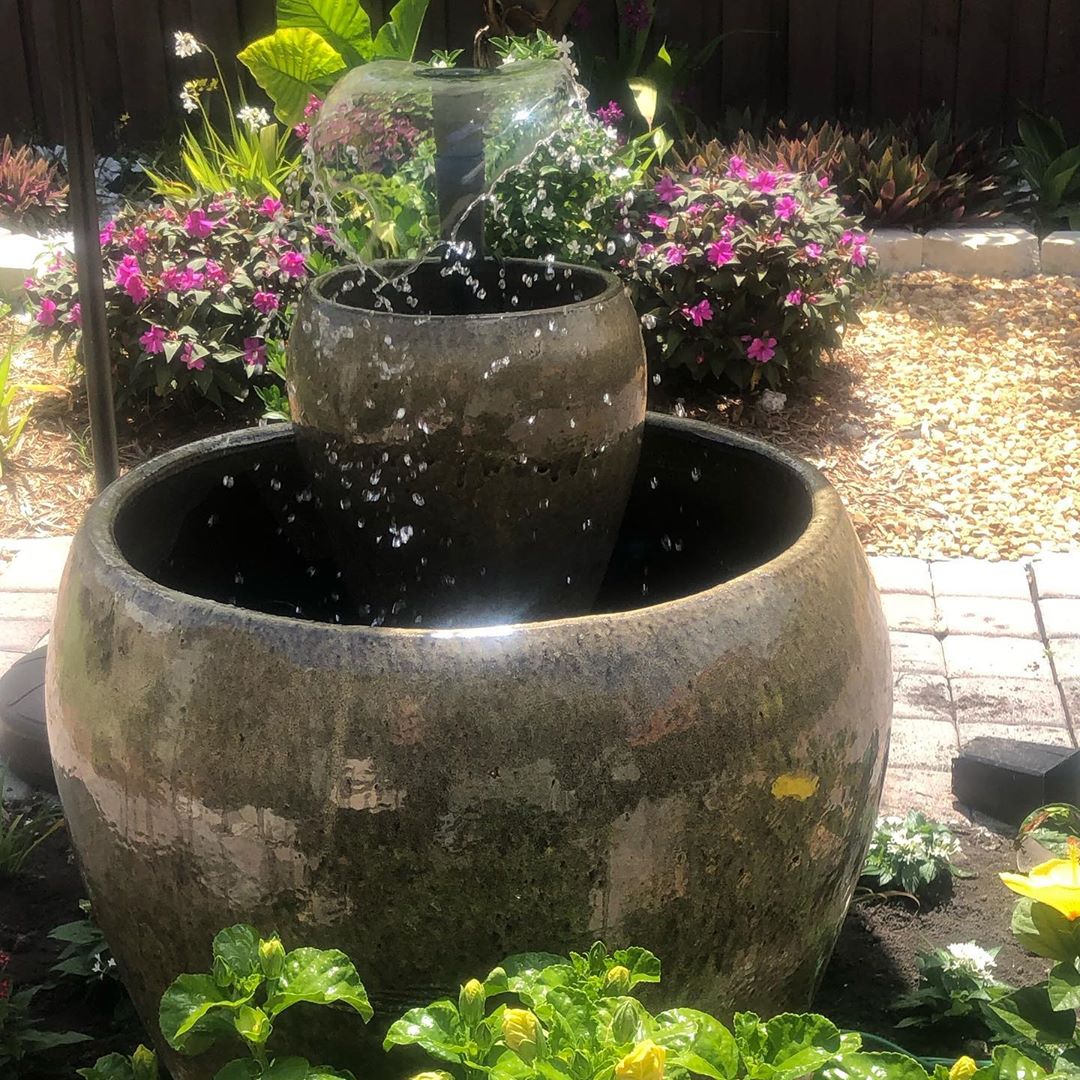 small backyard fountain built from old pots photo by Instagram user @zapata.thalia