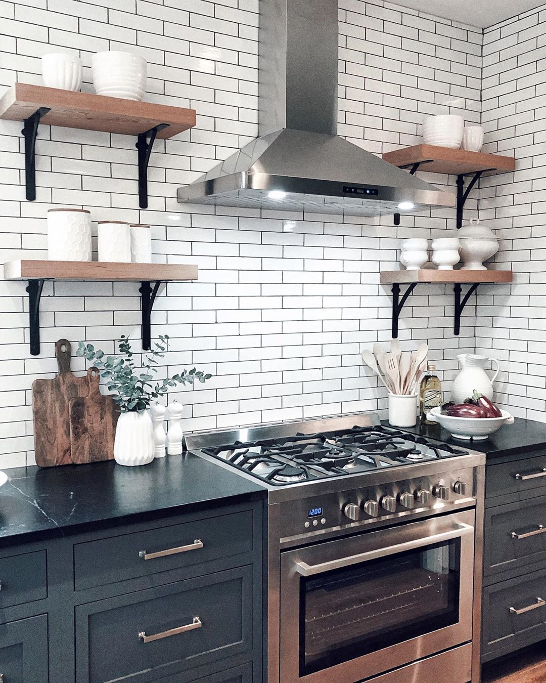 kitchen with subway tile backsplash with open shelving photo by Instagram user @henhurst