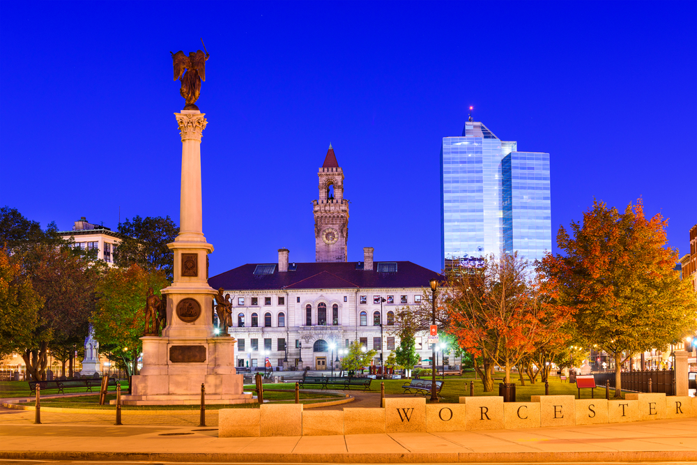 downtown worcester, MA at dusk with statue