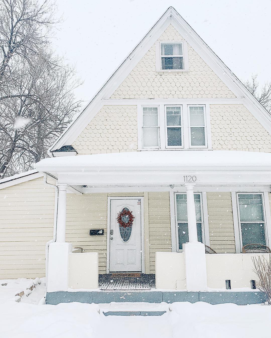 yellow bungalow style home in old colorado city with snow on the ground photo by Instagram user @brookemikulas