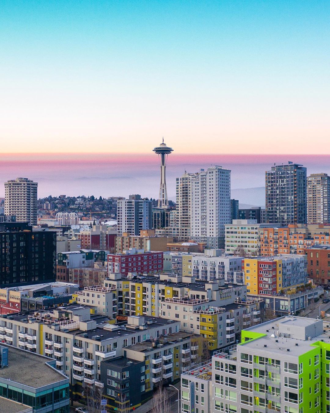 Skyline of Downtown Seattle with Space Needle in view at Dusk. Photo by Instagram user @codycm