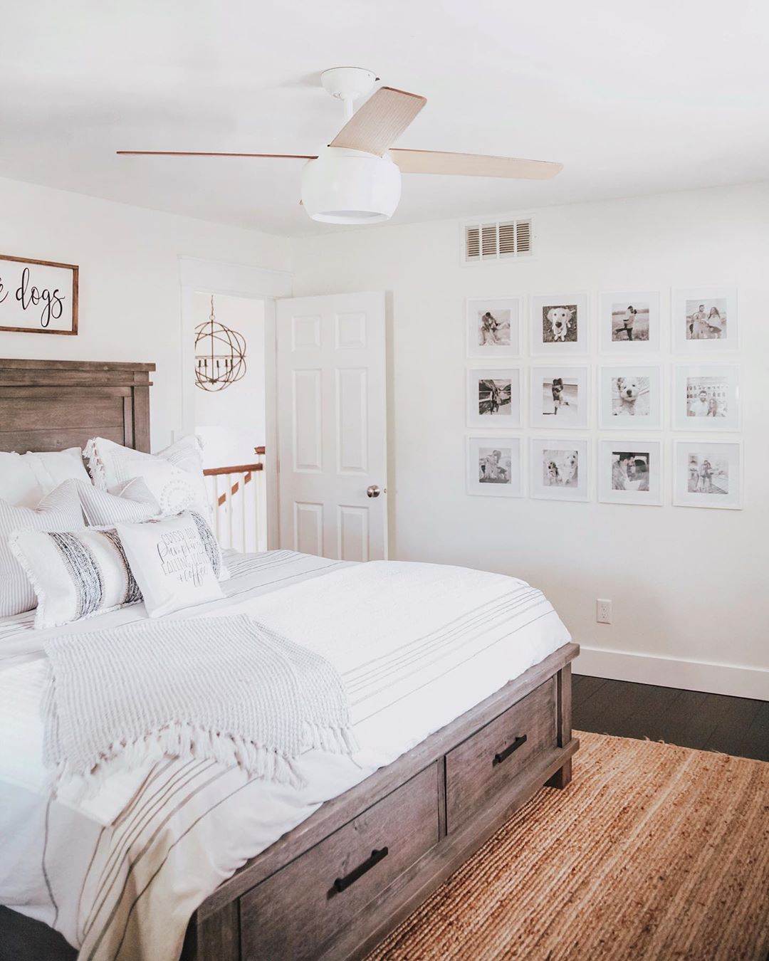 clean bedroom with gallery wall with dog photos and updated wood flooring photo by Instagram user @fashionablykay