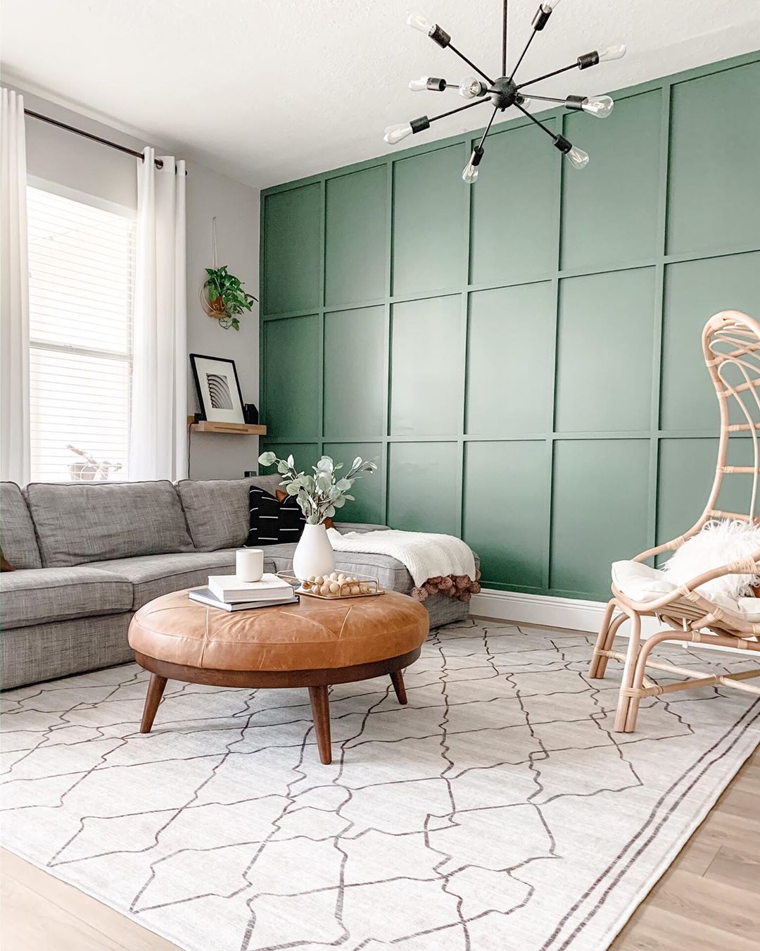 board and batten wall with green paint and modern furniture in the room photo by Instagram user @xomyhome