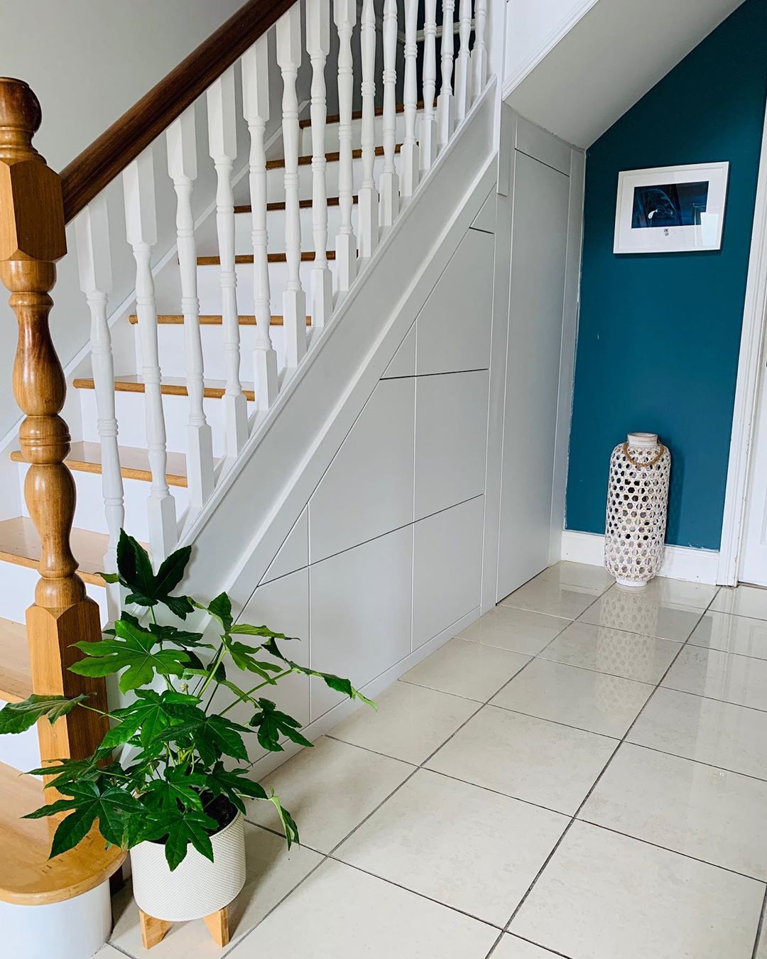 Staircase with storage drawers installed underneath photo by Instagram user @myrestyleproject