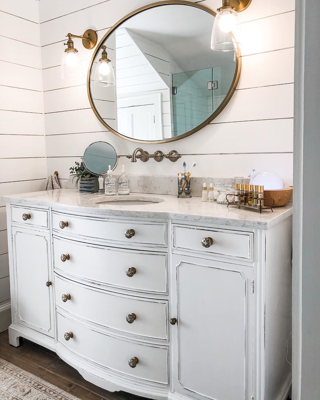 repurposed dresser used as a bathroom vanity photo by Instagram user @hkwdesign