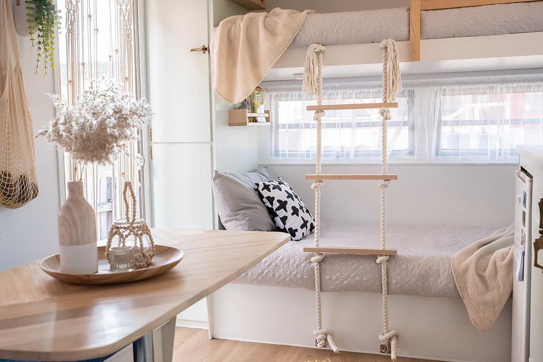 bunk beds added to RV with rope ladder installed to get to top bunk photo by Instagram user @fortheloveofmillie