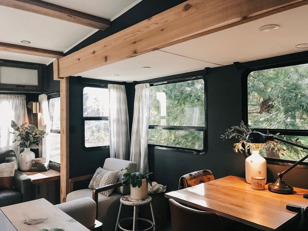 RV interior with reclaimed wood accents on walls and ceilings photo by Instagram user @tiny_oregon