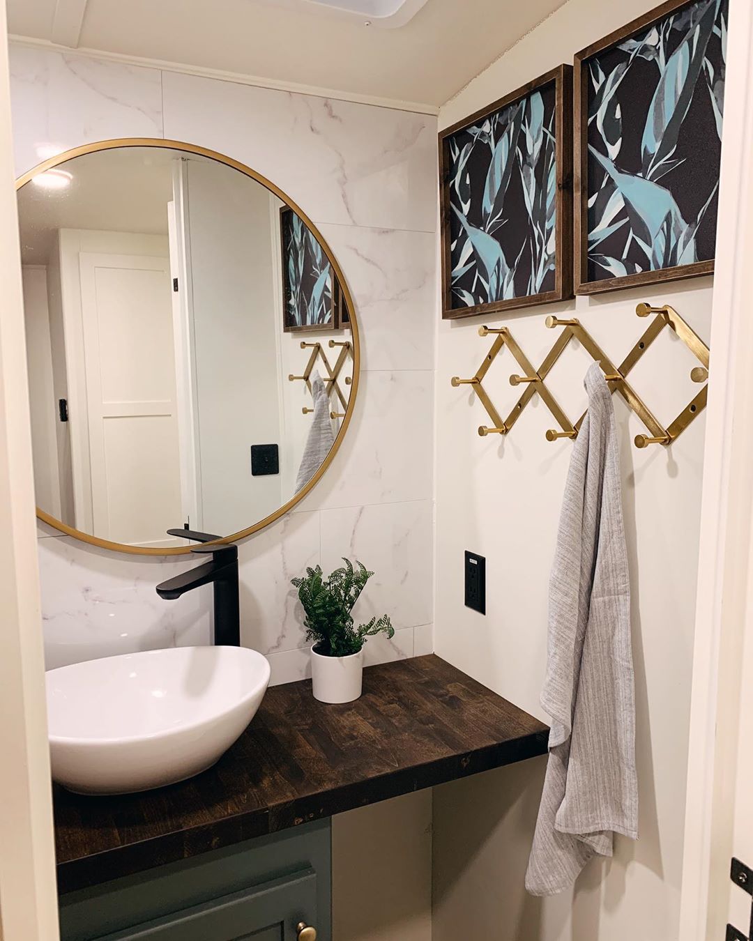 new bathroom vanity and mirror in RV photo by Instagram user @karleemmarsh