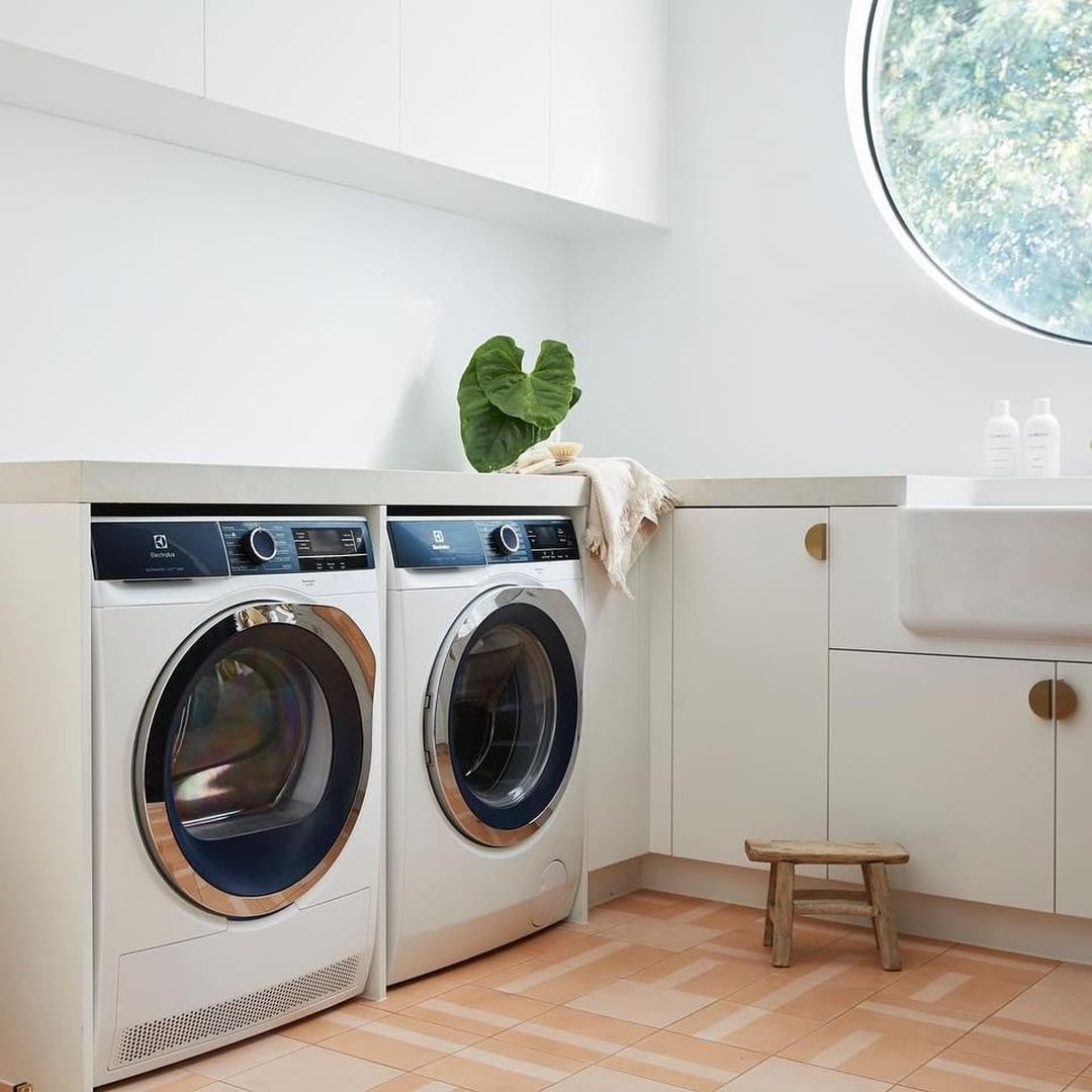 white laundry room with smart washer and dryer photo by Instagram user @designerappliancesau