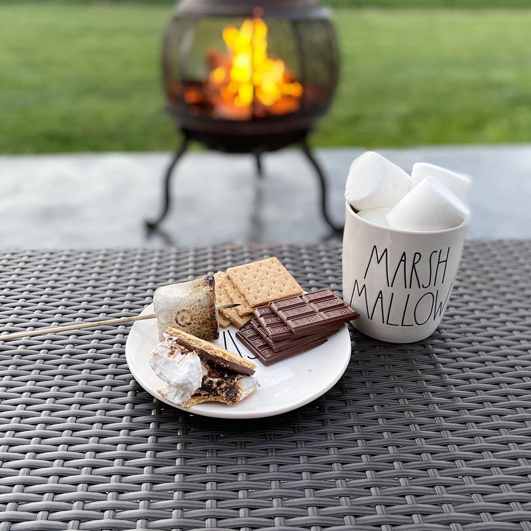 Smores Sitting on an Outdoor Table with More Mashmallows Nearby. Photo by Instagram user @rdunngraydecor